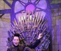 Visitor seated on the Iron Throne from Game of Thrones