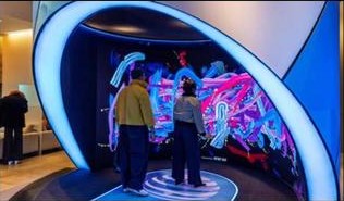 Body-tracking digital interaction display with mural